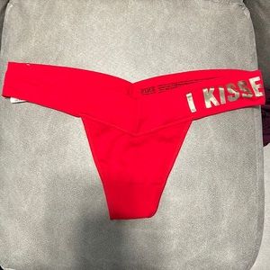 Brand New Thong pink Victoria’s Secret red color, size M, never been worn